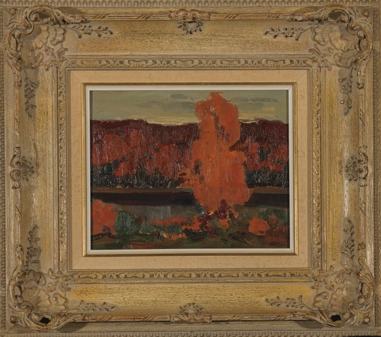 A painting surrounded by a gold frame.