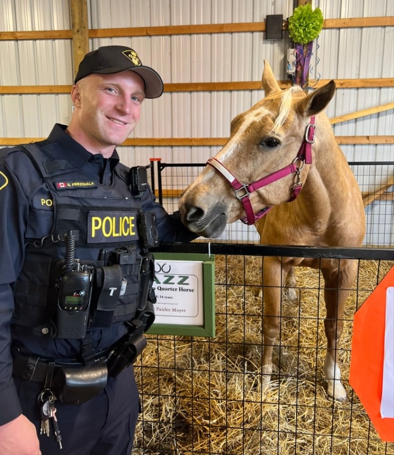 OPP Const. Grzegorz Pierzchal with a horse.