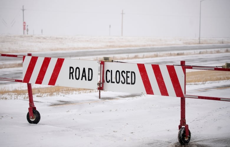 A road closed sign on a highway on ramp.