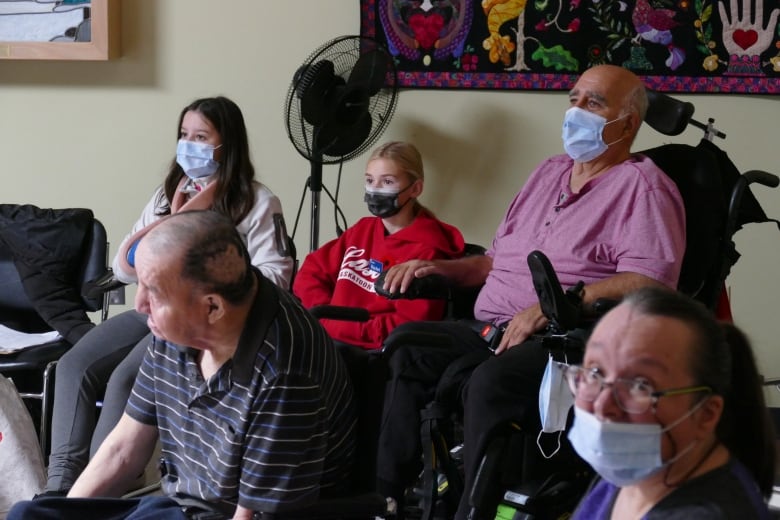 Students and residents interacting in the classroom. 