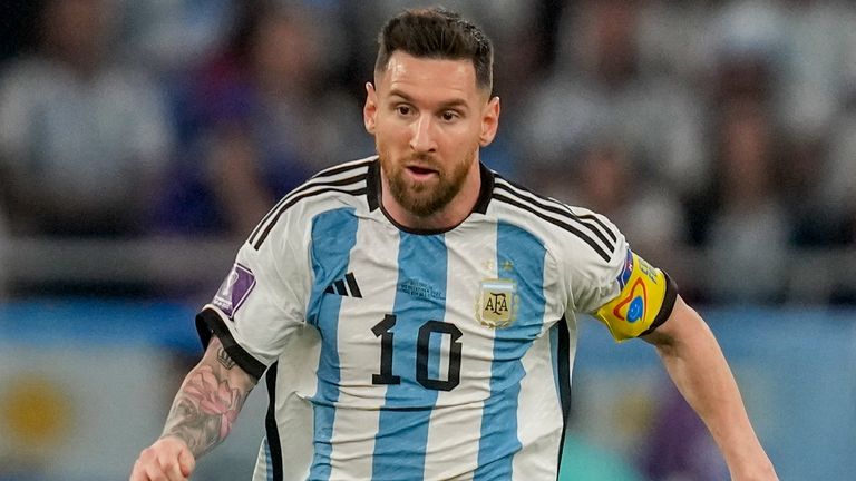 Lionel Messi runs at the Australia defence