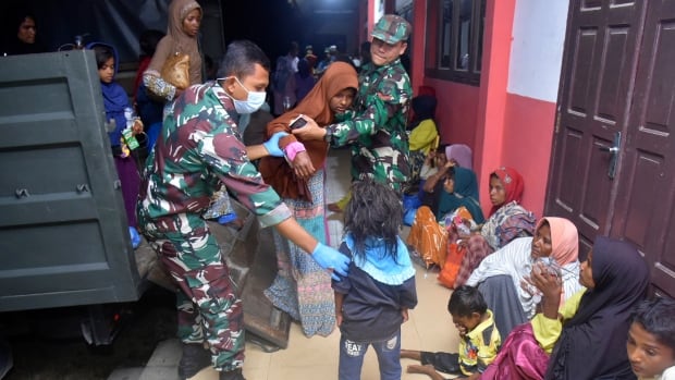 Second group of Rohingya refugees land on Indonesia beach after weeks at sea