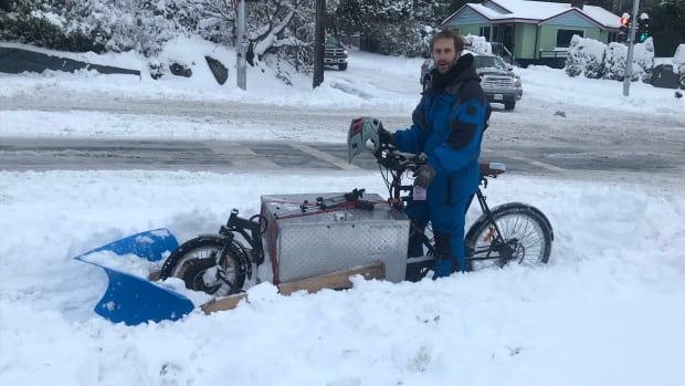 B.C. man creates bike-mounted plow to blast through the snow