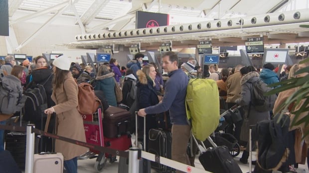 At Toronto’s main airport, stranded travellers are still waiting for answers after winter storm