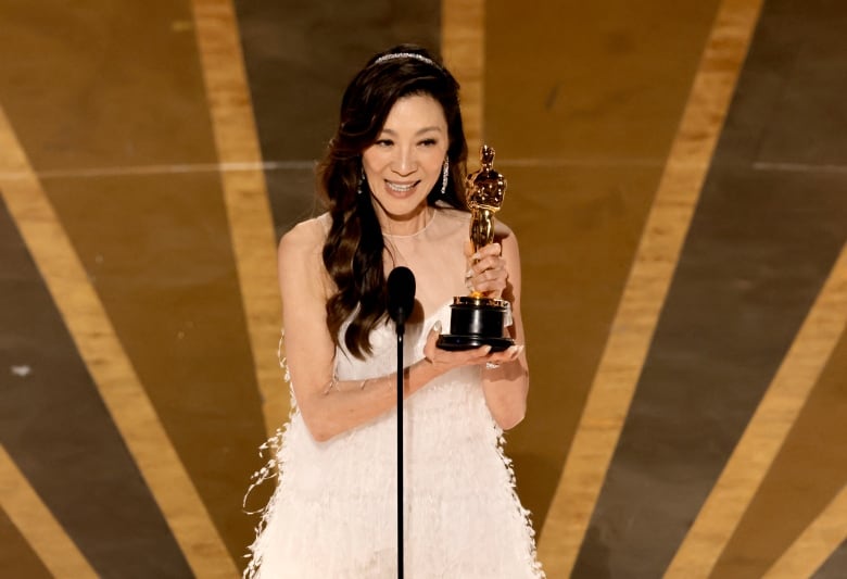 Woman in white gown wins award