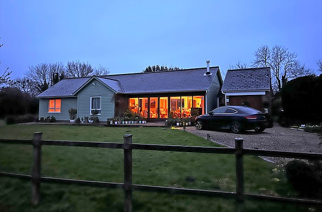 Kaur lives in this house (pictured) in a pretty village just outside Chippenham, Wiltshire, with a brand new Mercedes parked in the driveway