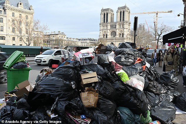 Garbage cans overflowing with trash on the streets as collectors go on strike in Paris