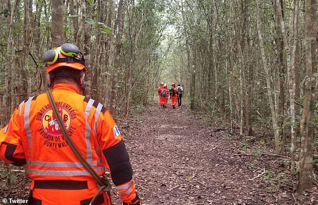 A volunteer rescuer with the Guatemalan team is pictured looking for Ashcroft