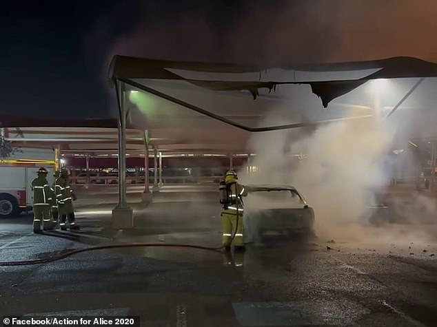 One video shows Mr Clarke talking to police at the site of the burned out car in the K-Mart car park