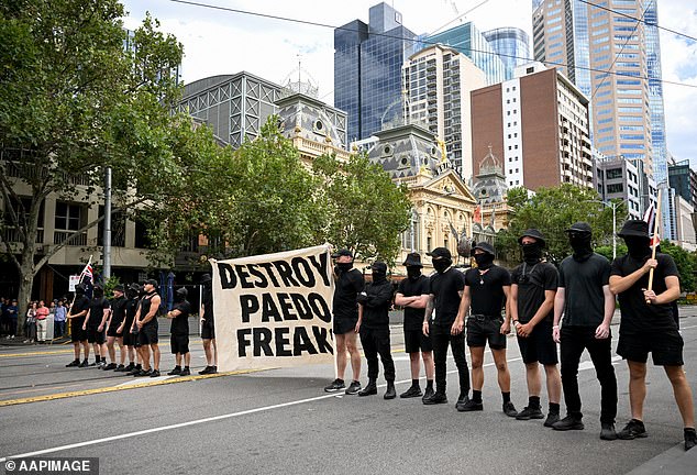 A group of Nazis held up an offensive sign as they clashed with trans rights activists on Saturday in Melbourne