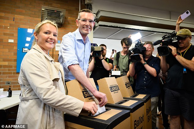 NSW Premier Dominic Perrottet casts his vote alongside wife Helen at Beecroft Public School in Sydney's north-west on election day