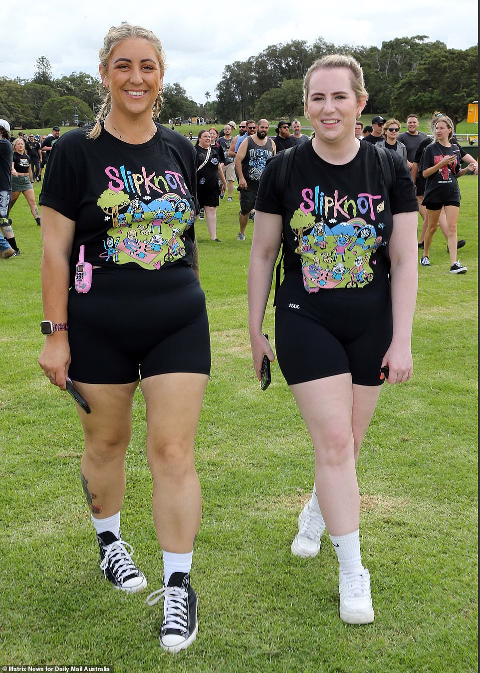 Communication is key!: Walkie-talkies are at hand for this duo wearing merchandise of the 8-piece heavy metal band, Slipknot, who have long been a cornerstone of the genre