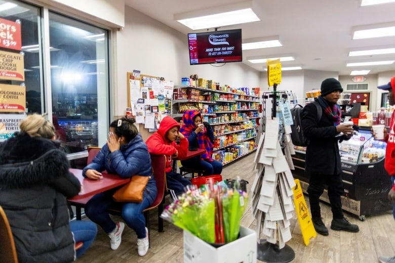 people in a gas station.