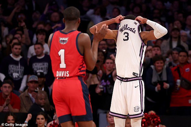 David N'Guessan pulls his jersey up over his face after fouling out during the game at MSG