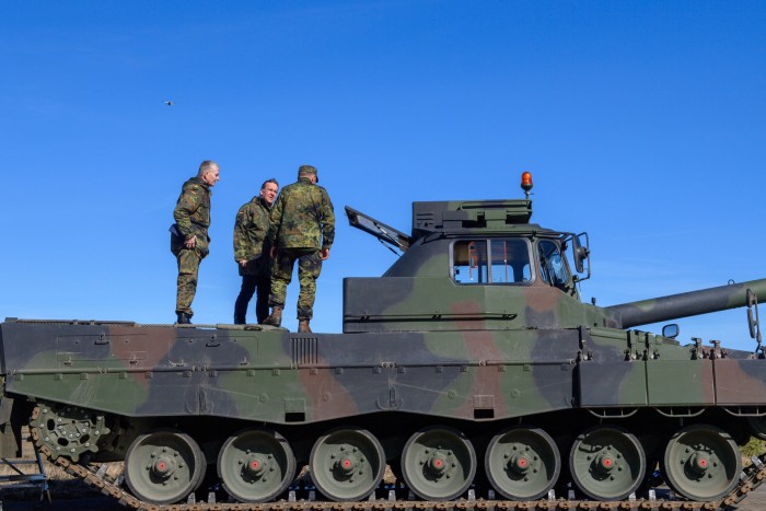 Boris Pistorius, German minister of defence, stands with Lieutenant General Martin Schelleis, on a Leopard 2 driving school tank