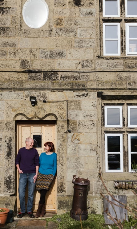 Phil and Sue Brown standing outside their home