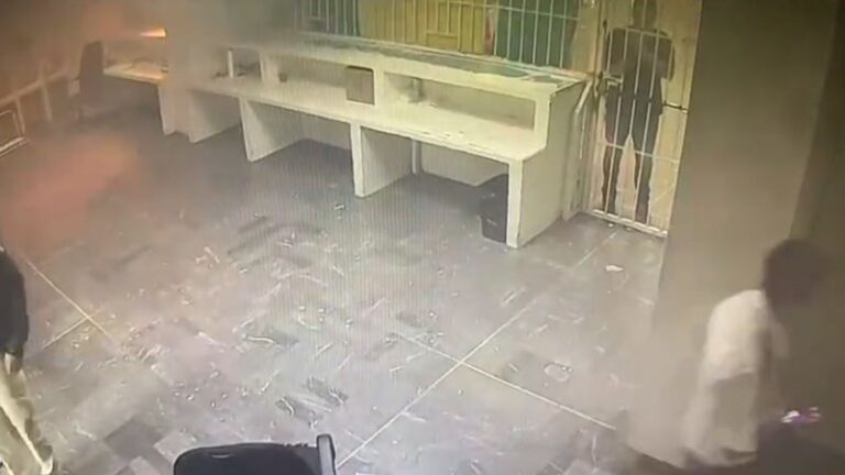 Video shows detainees locked behind gates as fire breaks out in detention center