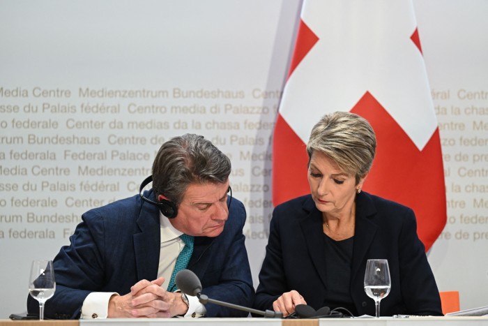 UBS Chairman Colm Kelleher (L) and Swiss Finance Minister Karin Keller-Sutter 