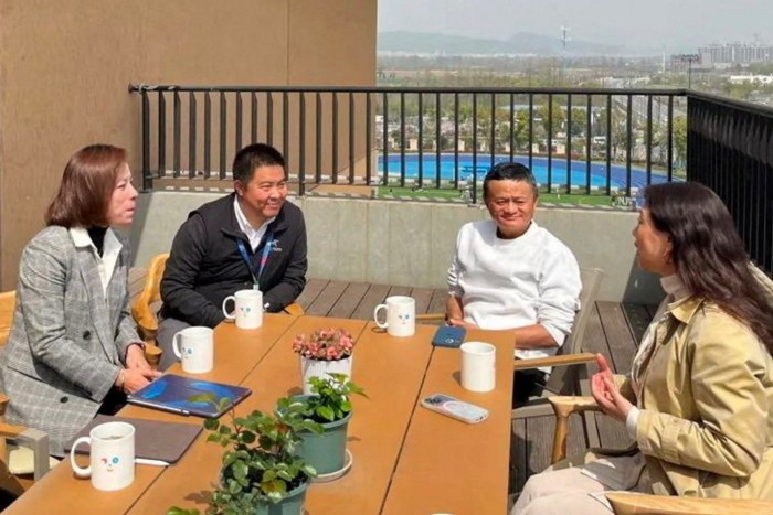 Alibaba founder Jack Ma, back right, visits a school in Hangzhou on his return to China after spending time overseas due to Beijing’s crackdown on the private sector