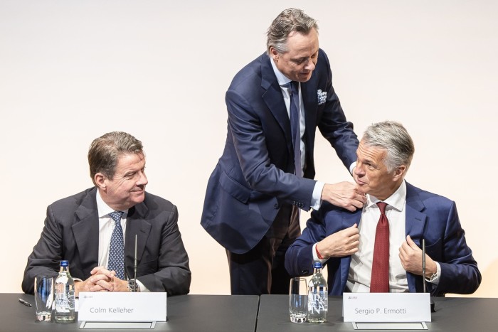 UBS chair Colm Kelleher, left, with new chief executive Sergio Ermotti and outgoing chief Ralph Hamers at a media conference in Zurich on Wednesday