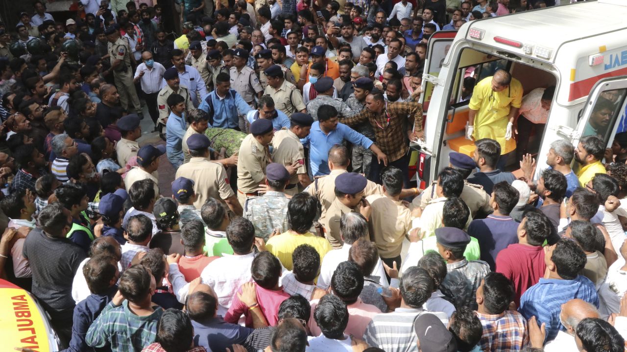 A victim is carried to an ambulance in Indore, India, on March 30.