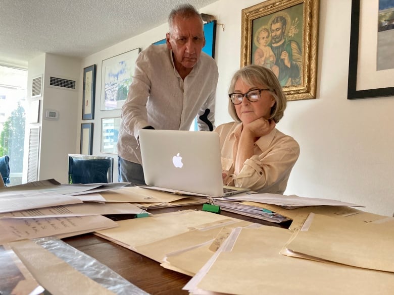 Alan Lawrence and his wife Patricia Onysko have amassed a tablefull of files relating to his application for Indian Status.