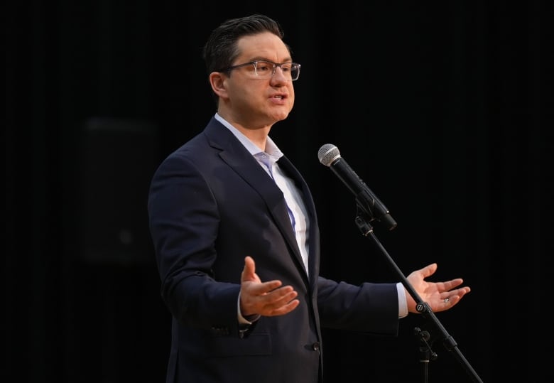 Conservative Leader Pierre Poilievre is pictured gesturing at an announcement in B.C.