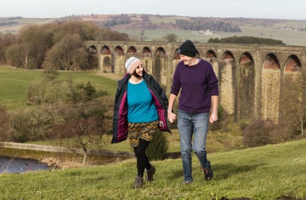 Phil and Sue Brown walking in the countryside.