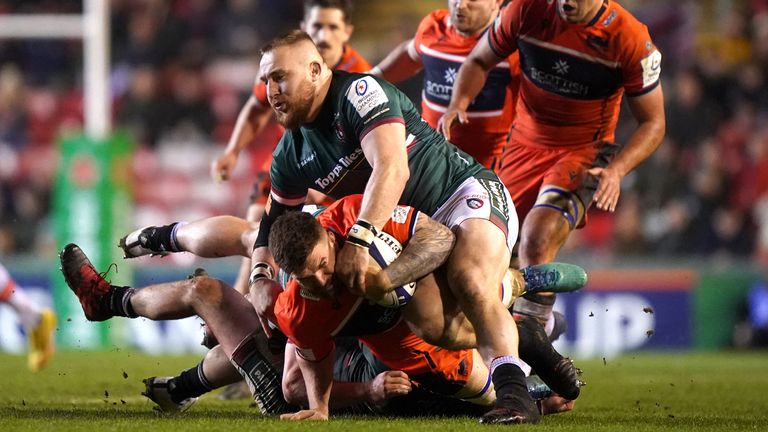 Edinburgh's Luke Crosbie is tackled by Leicester Tiger's Joe Heyes