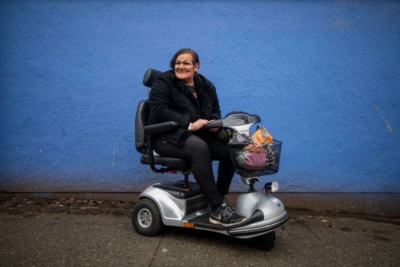 A woman in a wheelchair.