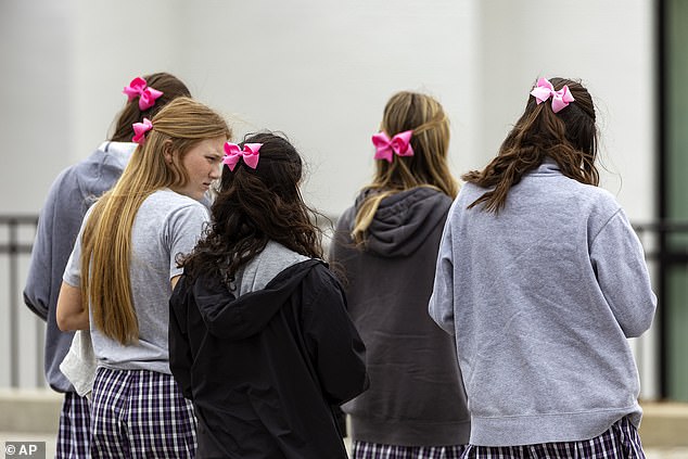 Mourners wore pink and green to pay tribute to Evelyn's 'light and love of color'