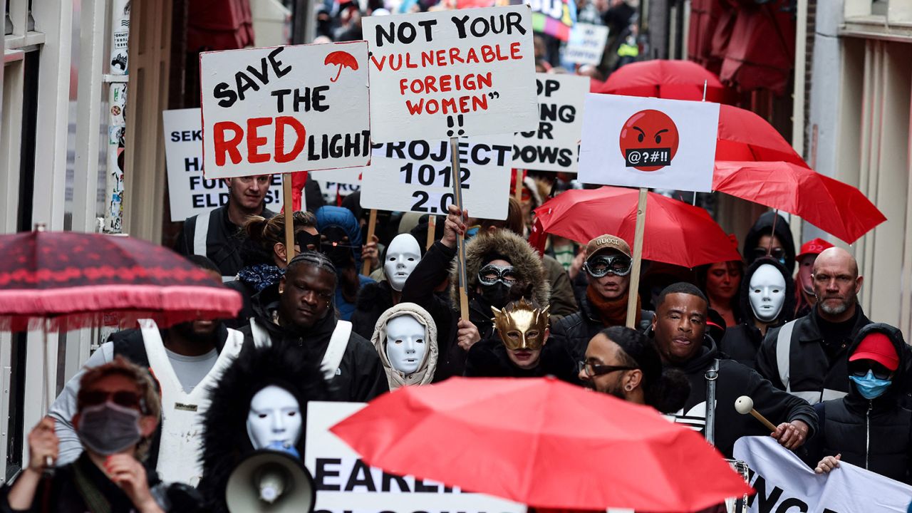 Sex workers and sympathisers take part in a demonstration to protest plans to shutter the city's historic red-light district.