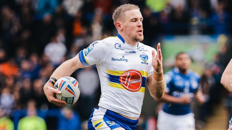 Matt Dufty races away to score a try for Warrington