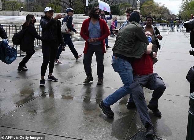 Only a few people on either side of the transgender culture war attended after the event was called off due to warnings of a 'credible threat to life and safety' by pro-trans activists