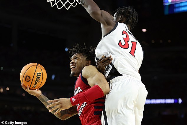 Nathan Mensah (right) of the San Diego State Aztecs defends against Alijah Martin (left)