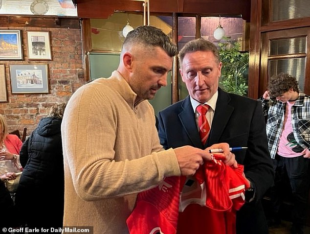 Former Irish rugby union player Rob Kearney (l), a distant Biden relative, was on hand when the president spoke at a pub