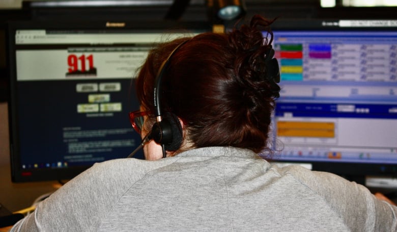 A 911 operator takes calls at her desk in Toronto Police's 911 communication centre.