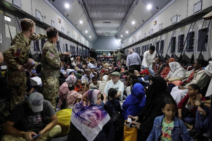 British nationals who got evacuated are seen onboard an RAF aircraft while on their way to Larnaca, Cyprus