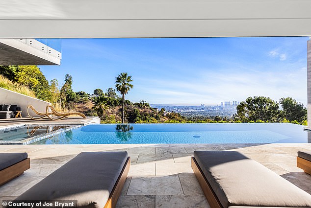 The pool deck offers plenty of space for sun bathing with plenty of loungers around the deck