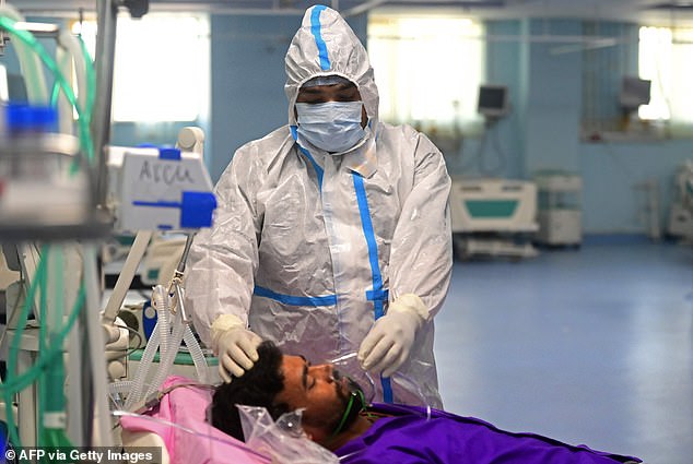 Health workers take part in a mock drill to check preparations for the Covid facilities at a hospital in Prayagraj on April 11, 2023