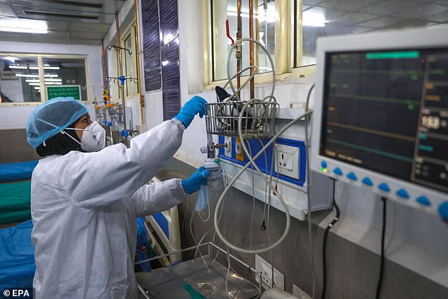 A paramedic checks equipment at an intensive care unit ward inside a local hospital in Srinagar on April 11, 2023