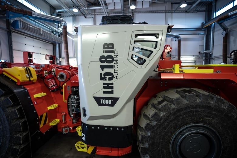 A side-photo of Sandvik's battery-electric loader. 