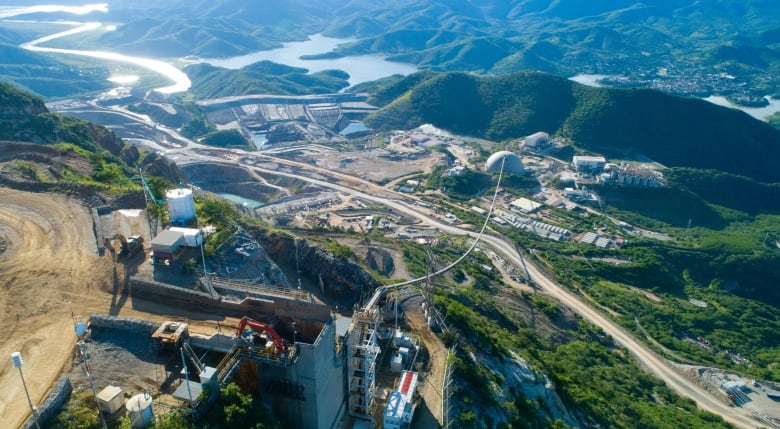 A photo of Torex's mining property featuring a large rope-based conveyor system.