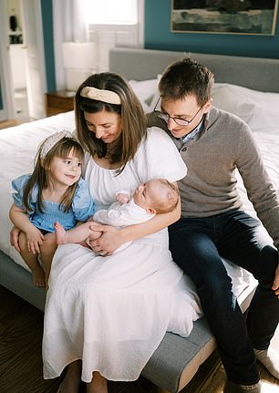 They are pictured in  their dream home with daughter Emmie, four, and son Archie, one