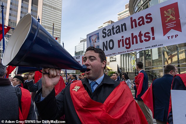 Members of The American Society for the Defense of Tradition, Family and Property protested outside the first day of the event