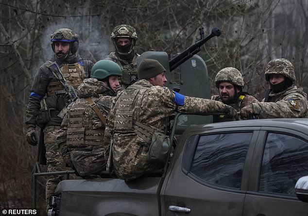 Ukrainian servicemen attend a joint drills at the border with Belarus near the Chernobyl Nuclear Power Plant, in the abandoned city of Pripyat, January 20, 2023