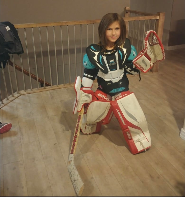 Girl in goalie gear