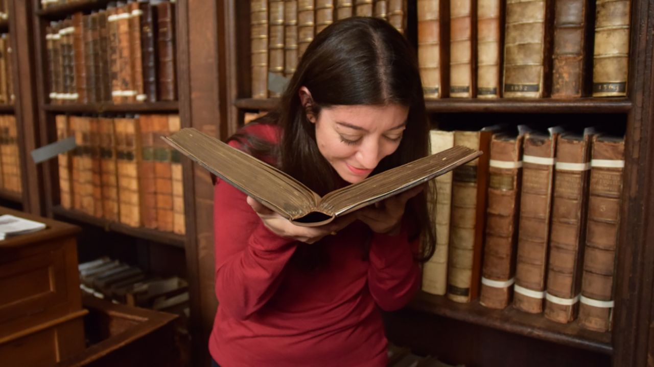 Sniffing a historic book at St. Paul's Cathedral library.