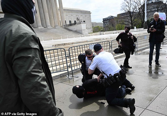 Trans activists clash with masked Neo-Nazis in violent brawl outside Supreme Court