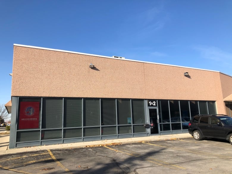 An images of a very plain brown building against a blue sky in Markham, Ont. It's said to be a secret Chinese police station.